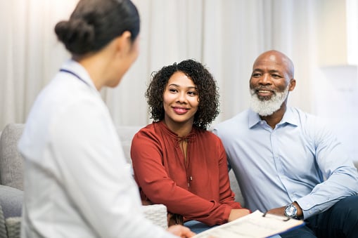 Dentist discussing sedation options at Dens Dental Studio in Chicago, IL