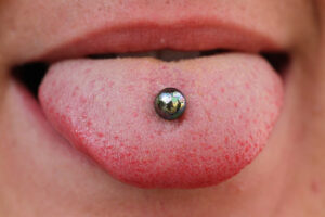 Close up of tongue piercing